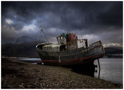 The wreck of the MV Golden Harvest, lying on its side on Caol Beach, Fort William