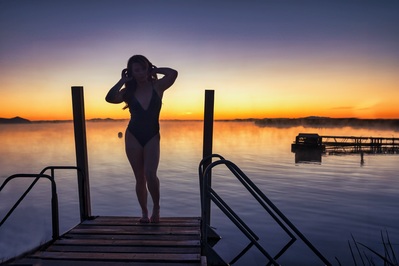 Image of model on diving dock before sunrise.  This was taken in late October so the warm water (80 degrees) causes steam to rise making for beautiful images.  The outside temp was about 21 degrees.