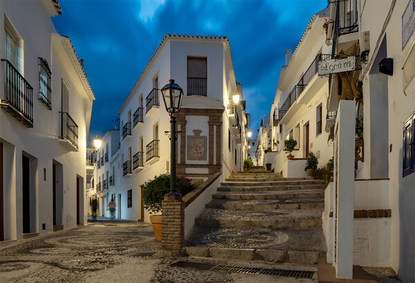 An evening photo of the streets and buildings, entering the historic area of Frigiliana.