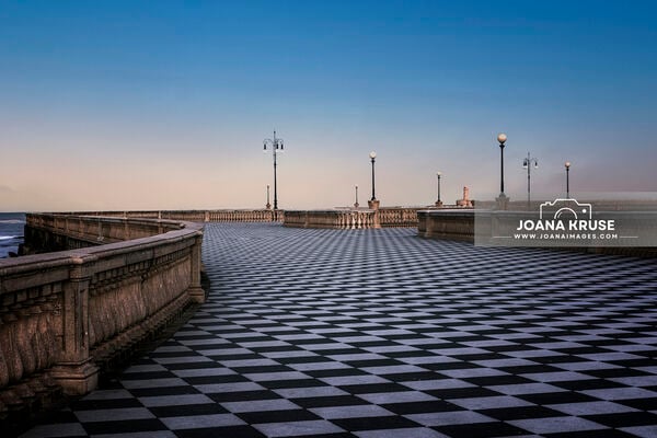 Terrazza Mascagni is a stunning panoramic square in the heart of Livorno, fondly known as the 'chessboard of the world' thanks to its unique black and white marble layout. 
