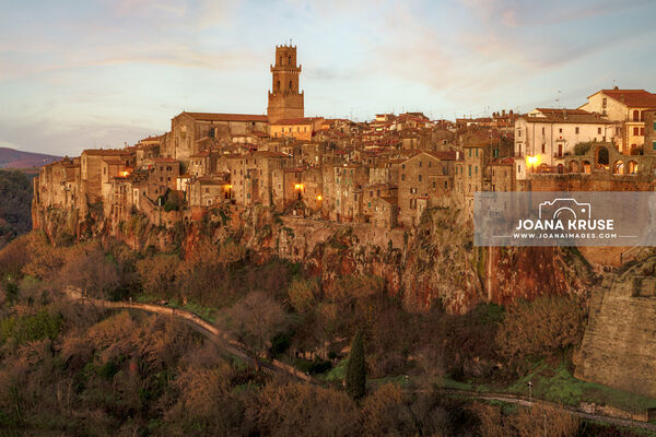 Pitigliano in the Maremma region of Tuscany is a stunner, perched atop a dramatic tuff stone cliff. The town's buildings have stood the test of time, creating a vertical wall of ancient structures above the deep drop of the tuff stone. The texture of the very old houses is amazing.