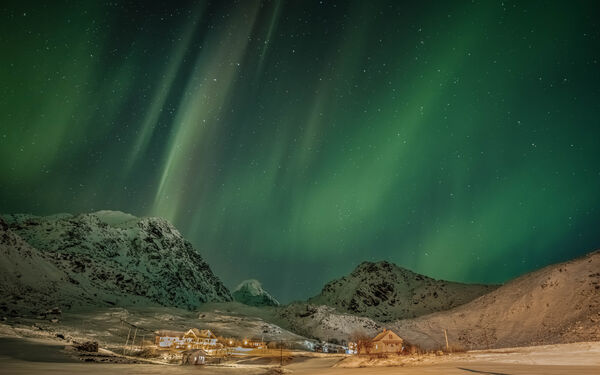 Northern lights shooting towards Mannen mountains 