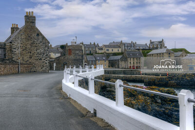 Historic fishing harbour and traditional fishermen's cottages in Portsoy, Aberdeenshire, Scotland.