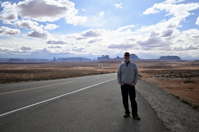This is an iconic view of Monument Valley in the background where one part of the movie called; Forest Gump character was shown to have jogged across the US with a crowd of people he had inspired that followed him. 
