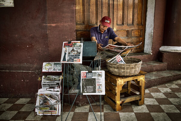 Street corner newspaper vendor in the main square