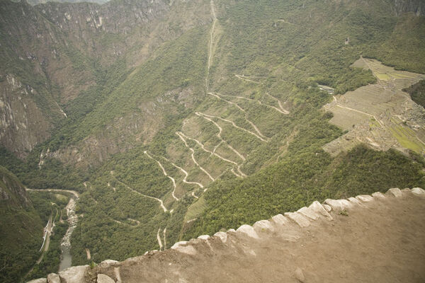 View of the switch-back road that the buses take to get up to Machu Picchu, which you can see on the right of the image. This was taken from Huayana Picchu above.