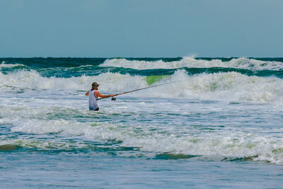 Surf fishing on the beach.